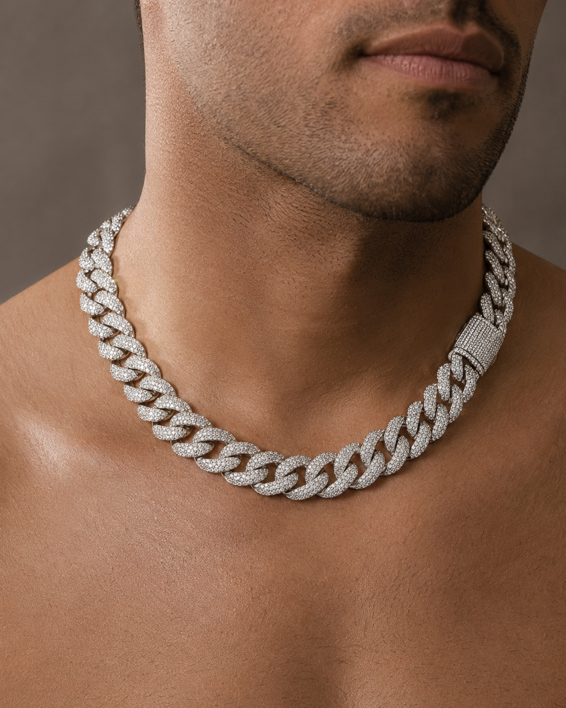 20 mm iced out Cuban link chain worn on a man's neck